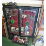 An Edwardian mahogany display cabinet with stained glass door