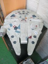 A constructed model The Millennium Falcon with remote control for lights and slope underneath,