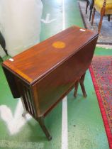 An Edwardian mahogany sutherland table on splay legs