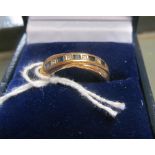 A 9ct gold diamond and sapphire ring