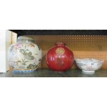 A modern oriental ginger jar decorated storks, red glazed spherical vase and bowl decorated birds