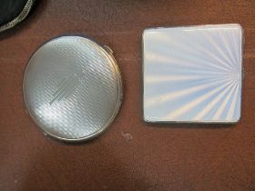 Two silver compacts