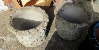 A pair concrete garden pots