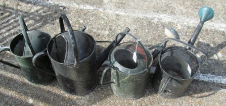 Four watering cans