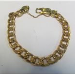 A gold coloured curb bracelet marked 375. 47.6g