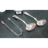 A pair of silver soup spoons and a pair of tongs