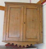 A pine corner cabinet
