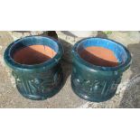 A pair blue garden pots with raised fruit design