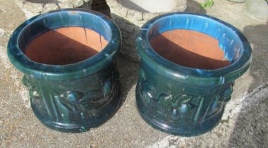 A pair blue garden pots with raised fruit design