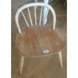 An Ercol dressing table stool with arched chair back (s/a/f)