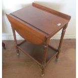 An oak two tier tea trolley