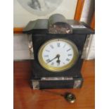 A Victorian black slate and marble mantle clock