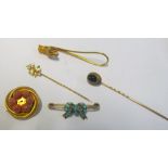 A gold coloured clip set hand with turquoise stone, turquoise set bow brooch, two stick pins and a