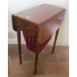 An Edwardian mahogany sewing table with basket on tapered legs