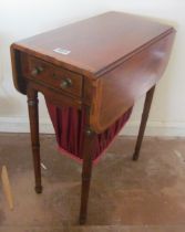 An Edwardian mahogany sewing table with basket on tapered legs