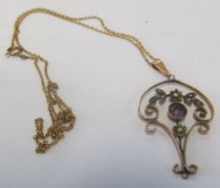 An Edwardian 9ct gold pendant set seed pearls and amethyst on chain