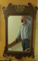 A Georgian style mahogany shaped framed mirror