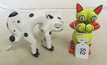 A Lorna Bailey green and orange sitting cat and a standing white and black cat