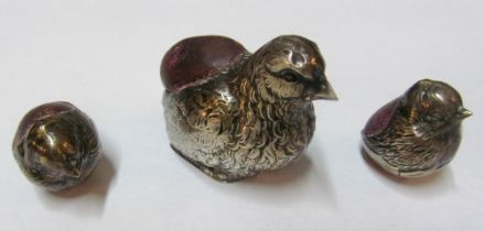 A silver bird pin cushion (mark obscured) and two chicks, marked Samson Morden & Co.