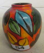 A small Poole RU pottery vase orange ground with leaves and fruit, by L. Wimarsh