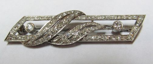 A platinum and diamond brooch