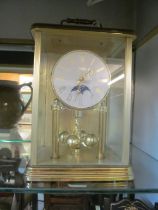 A Hermle Quartz 365 day clock with sun and moon aperture