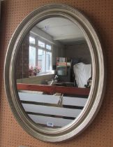 An oval gilt frame mirror