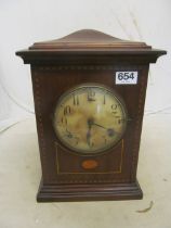 An Edwardian mahogany clock