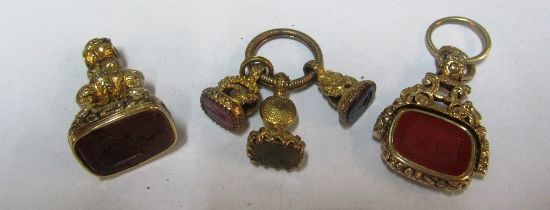 A swivel double seal fob, seal fob and three seals on a ring