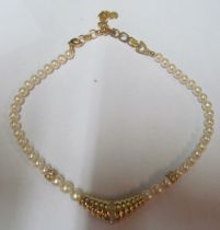 A Christian Dior necklace, graduation gold coloured lower section