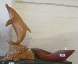 A treen dolphin and wooden fruit bowl