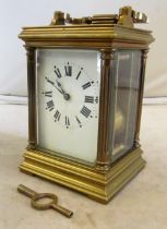 A 19th Century brass carriage clock with strike and key