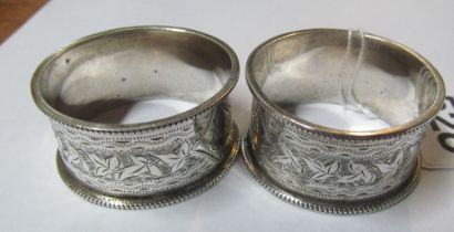 A pair of silver napkin rings