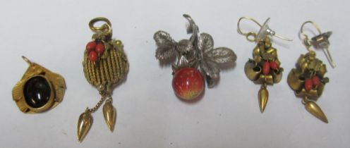 A strawberry brooch, two pendants and a pair of earrings
