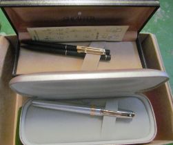 Various boxed pens