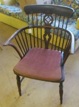 An antique beech and elm loop back chair