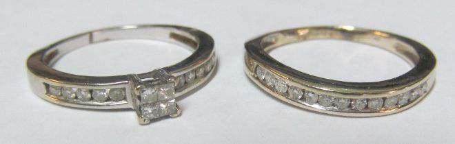 An 18ct white gold single stone diamond ring and another (both with chipped diamonds) Size M