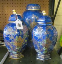 A Carlton Ware lidded jar and two hexagonal lidded vases (one a/f)