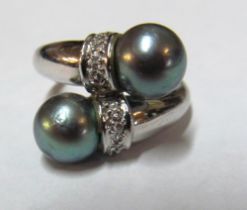 An 18ct gold Tahitian pearl and diamond ring marked 750 5.7g size N