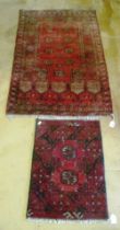 A Bokhara rug and another small one