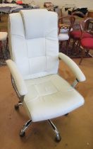 A cream leather office chair on swivel base