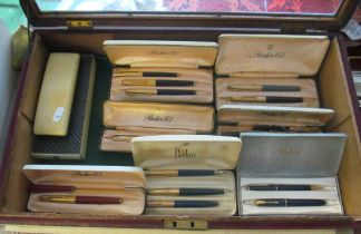 Various Parker pens with Parker 61 cases