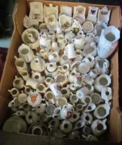 A box of heraldic china including nine chairs