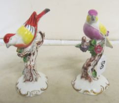 Two Capodimonte figures birds with flowers on branch (minor losses to flowers)