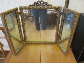 A gilt framed triple dressing table mirror