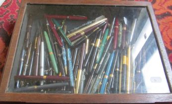 Various pens in table top display case