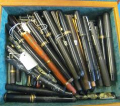 Various pens in leather clad box