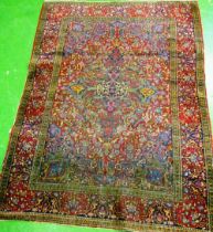 A blue and pink ground Persian rug stylized design (worn)