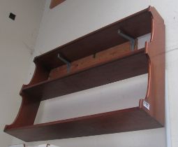 A mahogany wall shelf