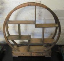 An oriental circular shelf unit